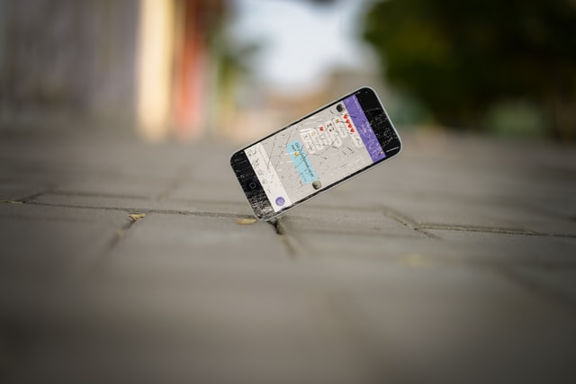 Phone with Love Messages Thrown on Ground