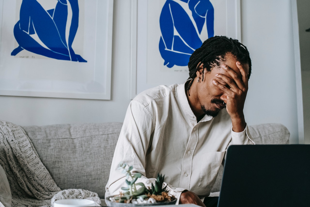 Upset Man Looking at Computer